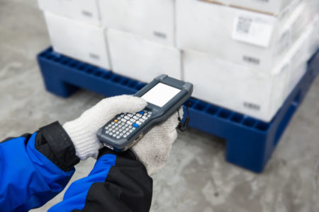 Bluetooth barcode scanner checking goods in the cold room or warehouse